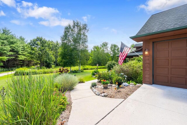 view of yard featuring a garage