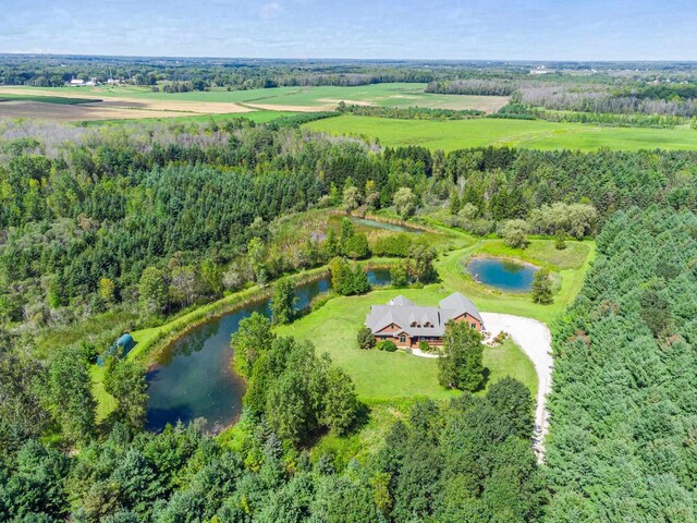 drone / aerial view with a rural view and a water view