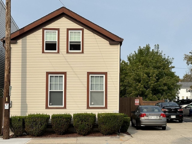 view of property exterior with fence