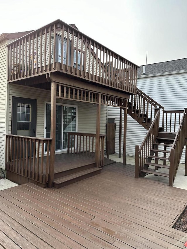 wooden terrace featuring stairs