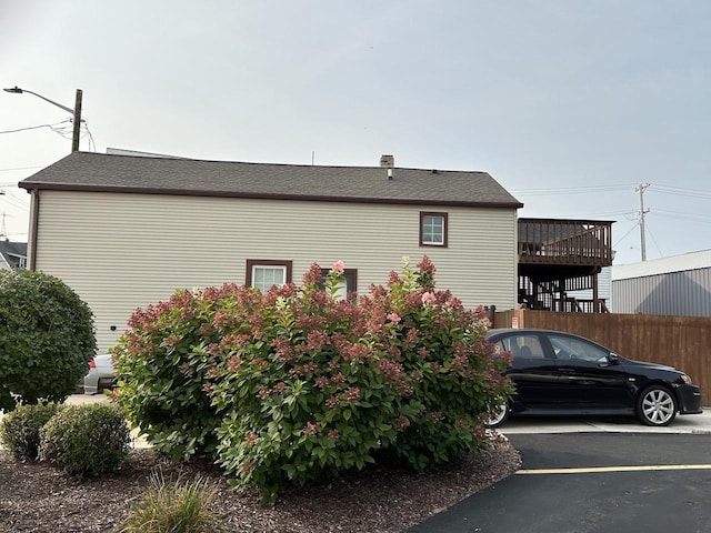 view of home's exterior with fence