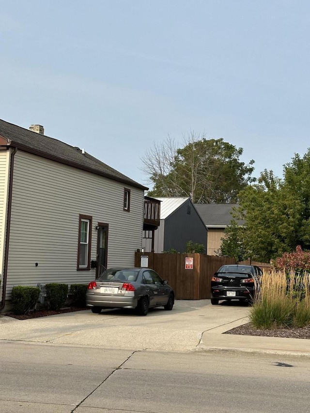 view of side of home with fence