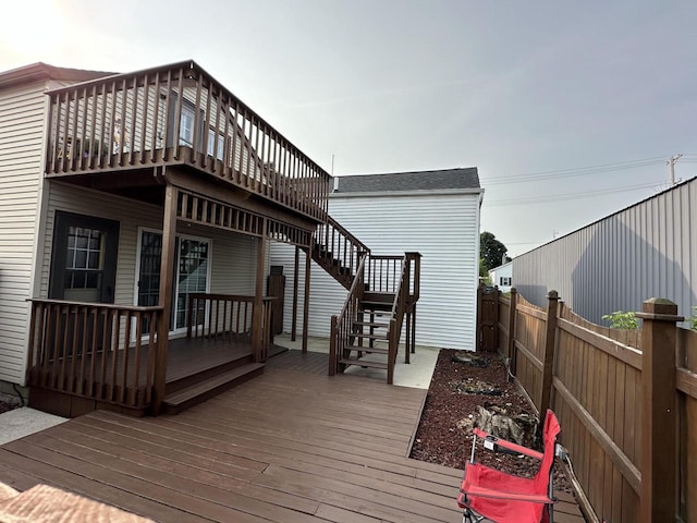 deck with stairway and fence