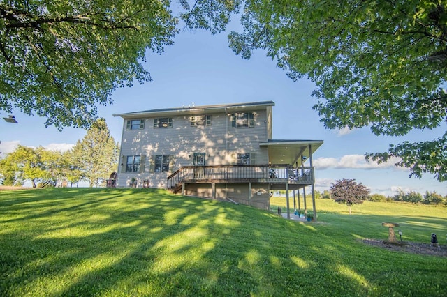 rear view of property with a lawn and a deck