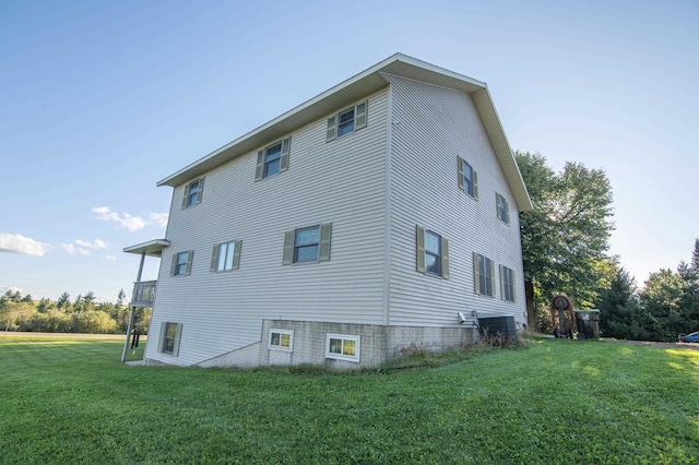 view of property exterior with a yard