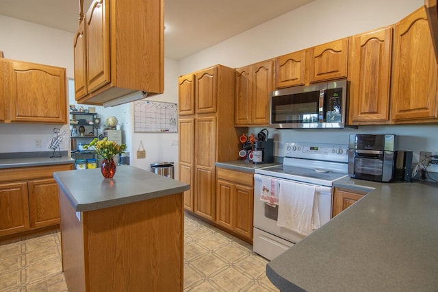 kitchen featuring a center island and white electric range