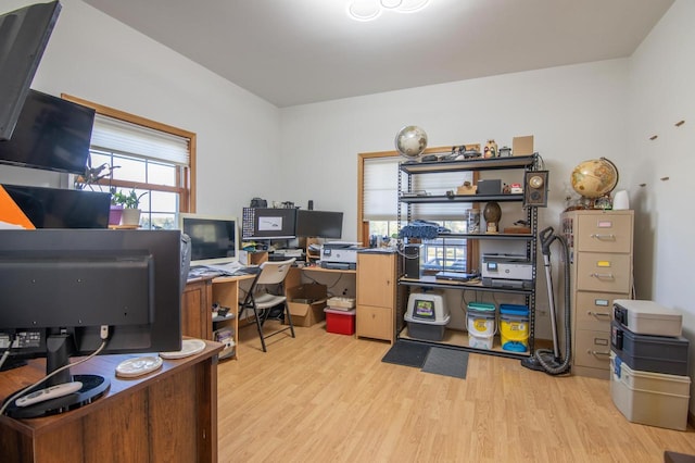 office space with light hardwood / wood-style floors