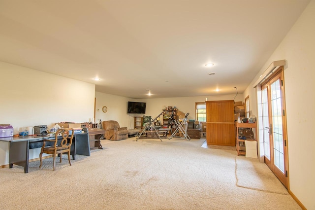 miscellaneous room with light colored carpet