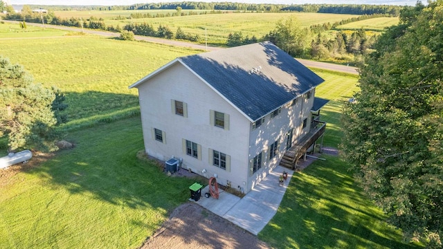 birds eye view of property with a rural view