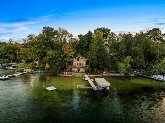 dock area with a water view and boat lift