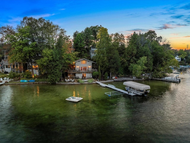 view of dock featuring a water view and boat lift