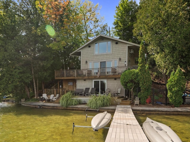 rear view of property featuring a lawn and a patio area