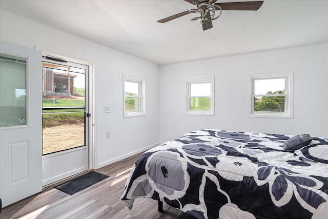 bedroom featuring light hardwood / wood-style flooring and ceiling fan