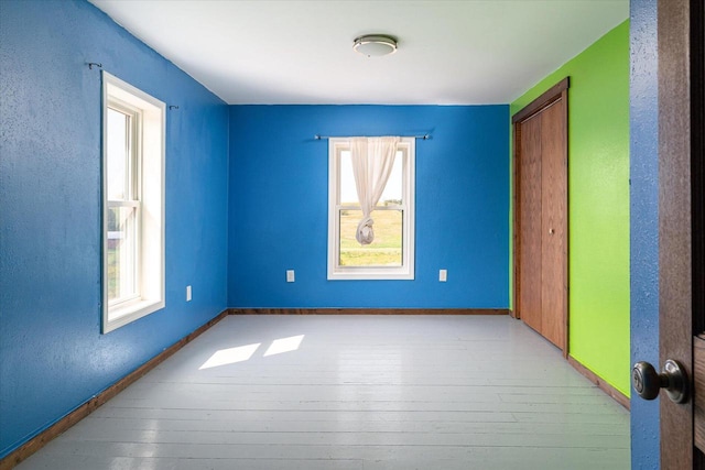 empty room with light hardwood / wood-style flooring