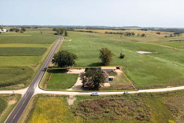 birds eye view of property with a rural view