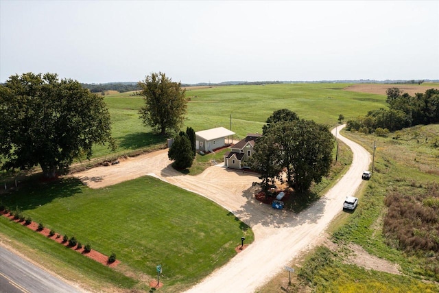 birds eye view of property with a rural view