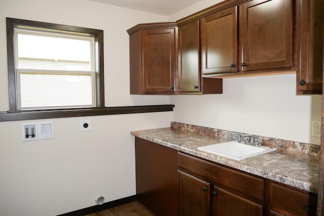 washroom featuring hookup for an electric dryer, washer hookup, dark hardwood / wood-style floors, and sink