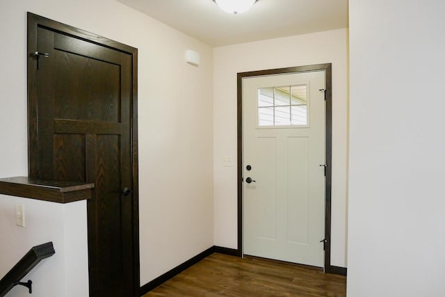 doorway with dark hardwood / wood-style floors