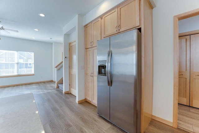 kitchen featuring light hardwood / wood-style flooring, ceiling fan, light brown cabinetry, and stainless steel refrigerator with ice dispenser