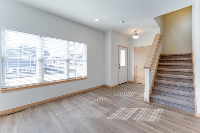 foyer entrance featuring light hardwood / wood-style flooring