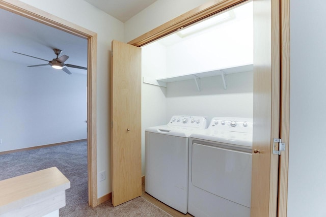 laundry room with washer and dryer, ceiling fan, and light carpet