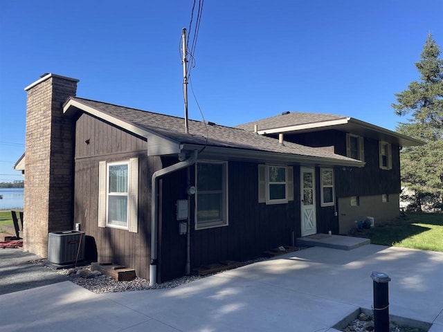 view of side of home with cooling unit