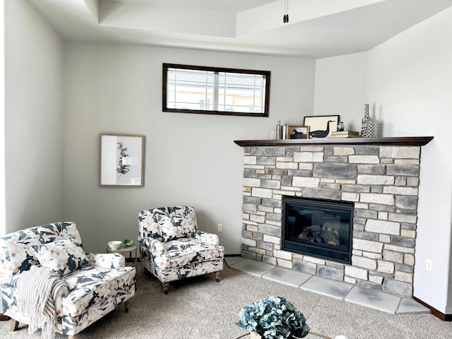 carpeted living room with a fireplace