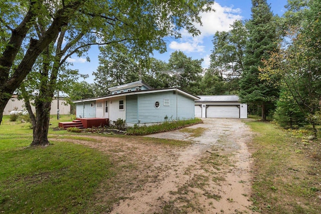 view of front of home with a garage and a front yard