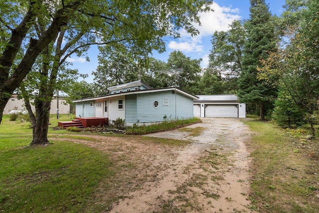 N1802 Shambeau, Waupaca, WI 54981 - view of front facade with an outbuilding, a front lawn, and dirt driveway
