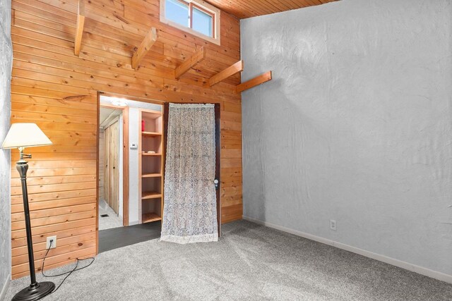 N1802 Shambeau, Waupaca, WI 54981 - unfurnished bedroom featuring wooden ceiling, wood walls, and carpet floors