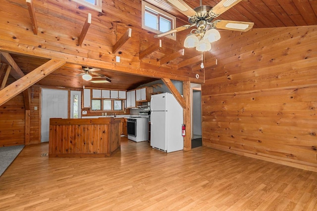 kitchen with ceiling fan, white appliances, wooden ceiling, and a healthy amount of sunlight