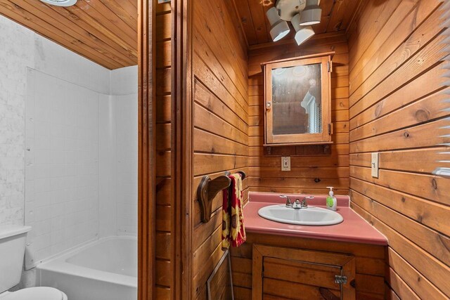 N1802 Shambeau, Waupaca, WI 54981 - bathroom with wood ceiling, wood walls, toilet, and vanity