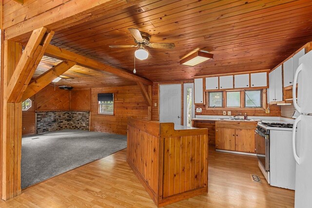 kitchen with wood ceiling, white appliances, a wealth of natural light, and light hardwood / wood-style flooring