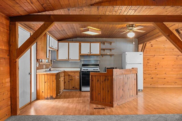 N1802 Shambeau, Waupaca, WI 54981 - kitchen with white cabinetry, lofted ceiling with beams, freestanding refrigerator, light countertops, and range with gas cooktop