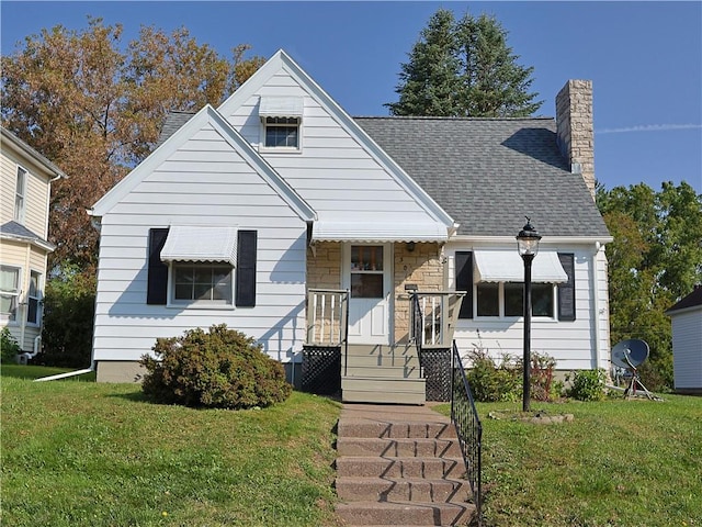 bungalow-style house with a front yard