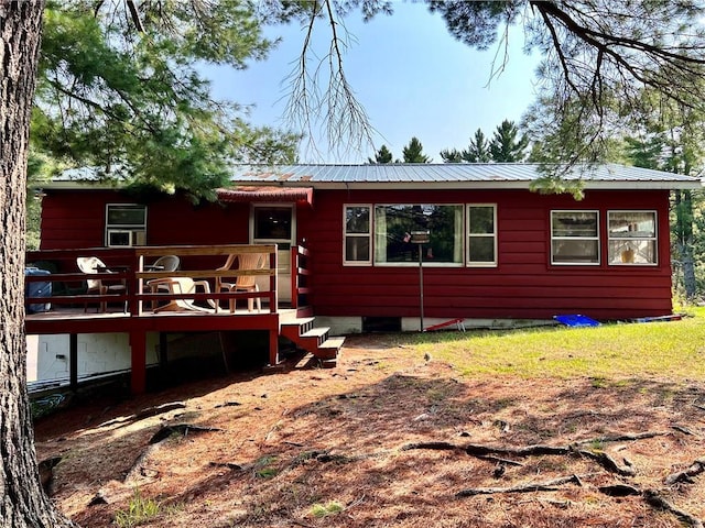 15366 W Reiskies Rd, Hayward, WI 54843 - back of house with a deck and a metal roof