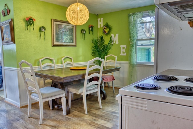 dining space with light hardwood / wood-style floors