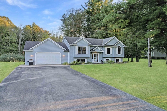 bi-level home with a front lawn and a garage