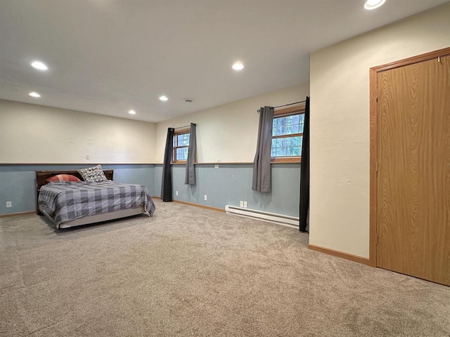 bedroom with a baseboard radiator and carpet floors