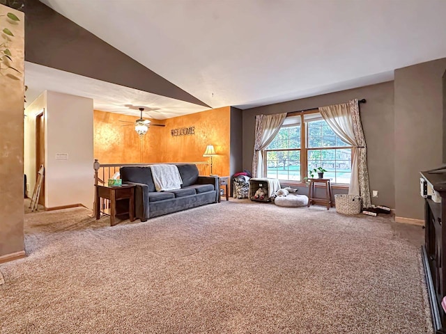 unfurnished living room with carpet flooring, ceiling fan, and vaulted ceiling