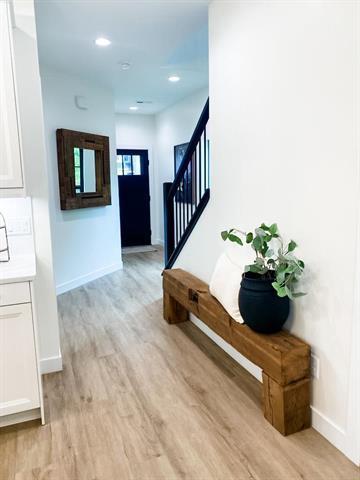 interior space featuring recessed lighting, wood finished floors, and baseboards