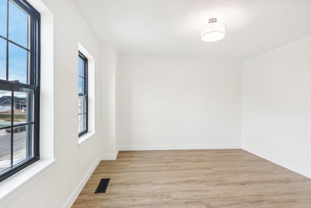 317 Maple St, Pardeeville, WI 53954 - empty room with light wood finished floors and baseboards