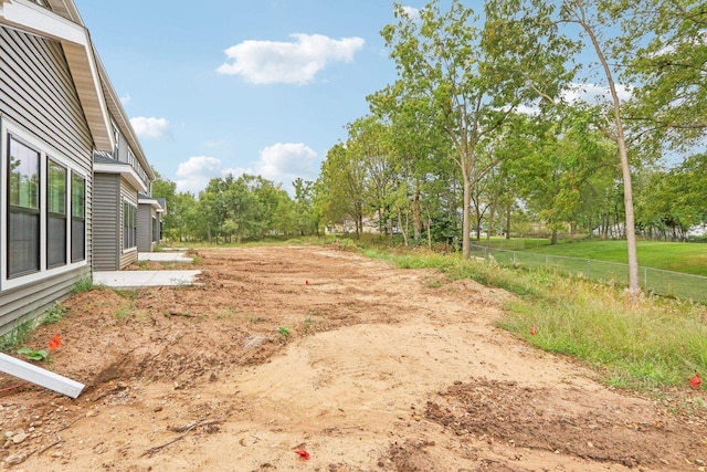 317 Maple St, Pardeeville, WI 53954 - view of yard featuring view of scattered trees and fence