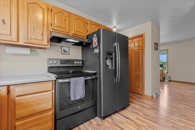 kitchen with light wood finished floors, light countertops, stainless steel refrigerator with ice dispenser, under cabinet range hood, and black electric range oven