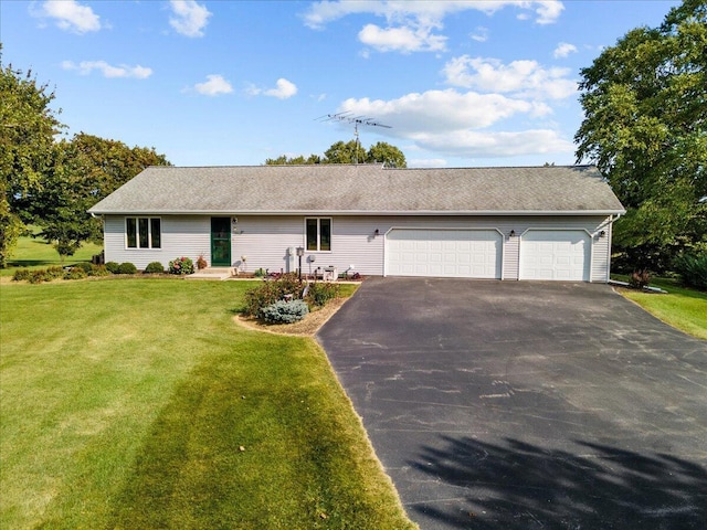 ranch-style house featuring aphalt driveway, a garage, and a front yard