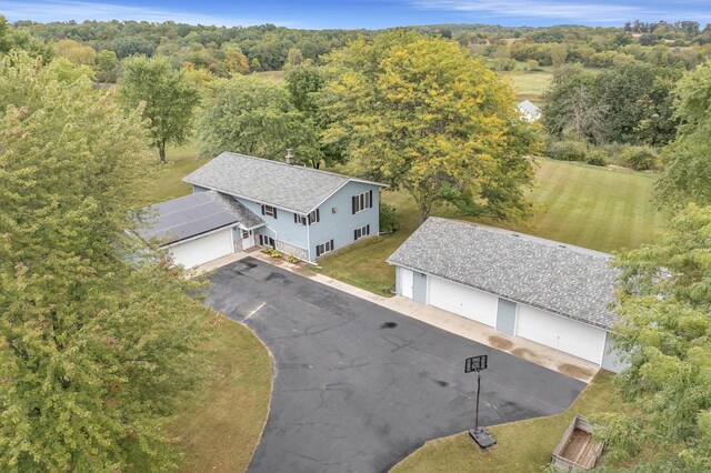 view of front of house featuring solar panels and a front yard