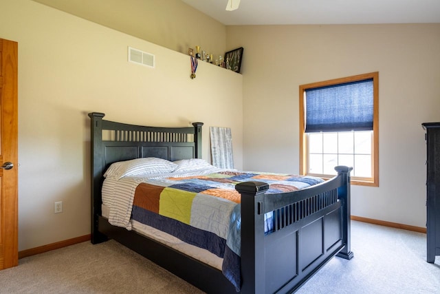 bedroom featuring lofted ceiling, ceiling fan, and light carpet