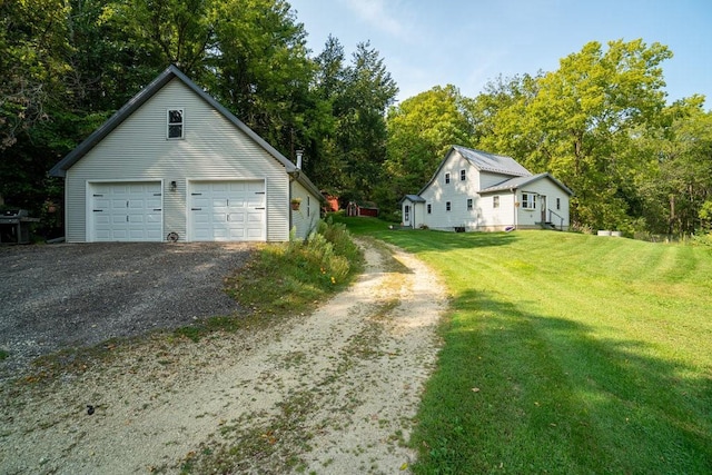 garage featuring a yard