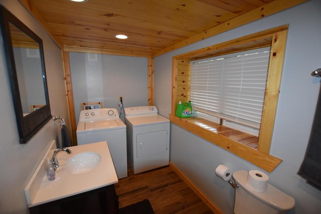 bathroom featuring wood-type flooring, toilet, wooden ceiling, and washing machine and dryer