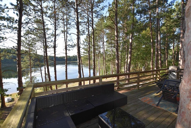 wooden deck featuring a water view